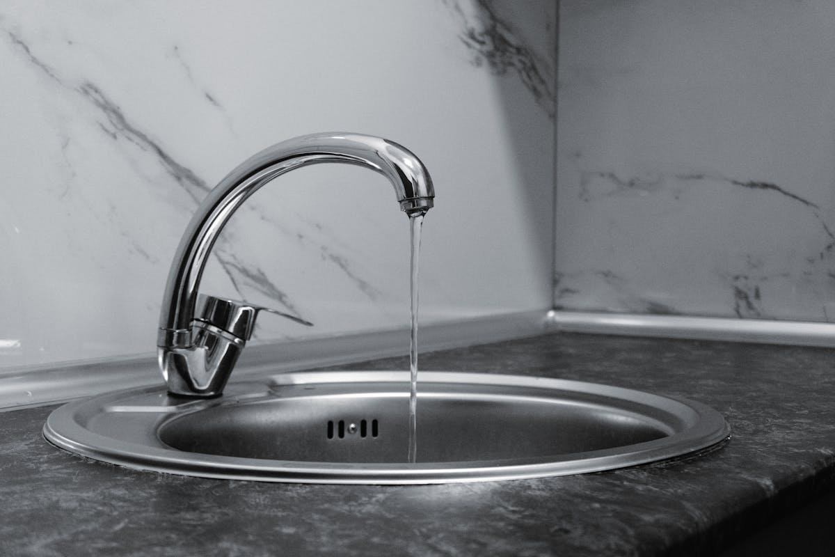 Clear glass of water being filled at a South Florida kitchen tap